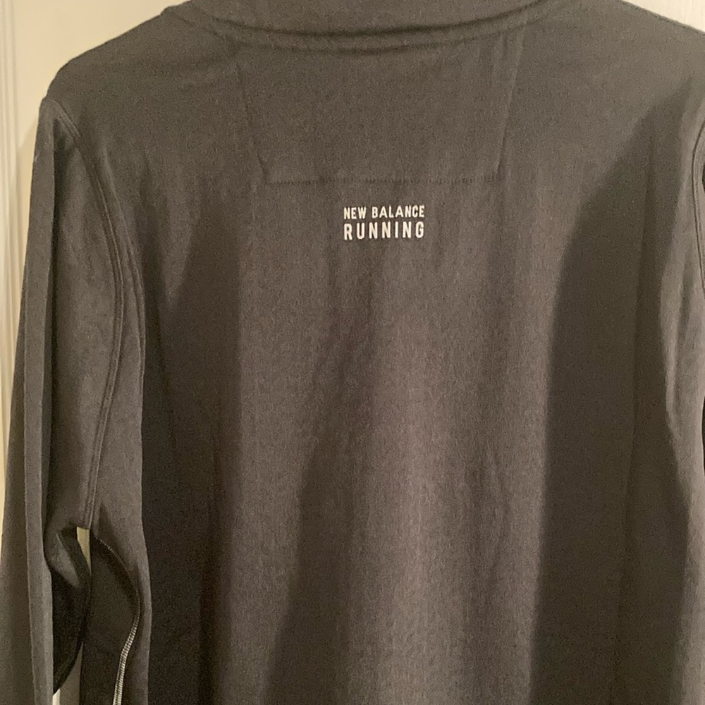 New Balance men’s running light pullover jacket.